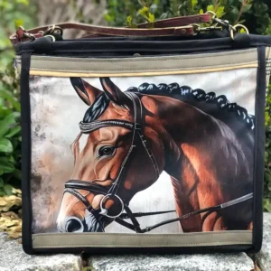 Custom black tote bag featuring a detailed illustration of a horse's head, resting on a stone ledge with a leather shoulder strap.