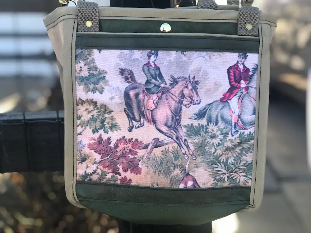 Custom green tote bag featuring a detailed illustration of a horse and rider with leaves, with a leather shoulder strap.