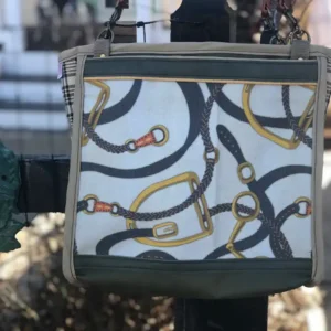 Custom green tote bag featuring a detailed illustration of horse straps, with a leather shoulder strap.
