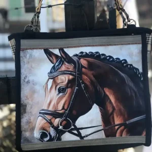 Custom black tote bag featuring a detailed illustration of a horse's head, resting on a stone ledge with a leather shoulder strap.