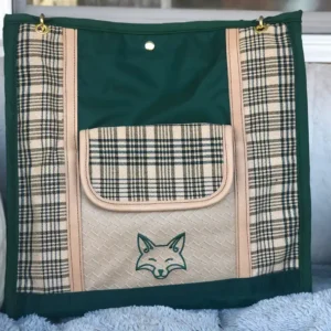 Custom green plaid tote bag, with a leather shoulder strap.