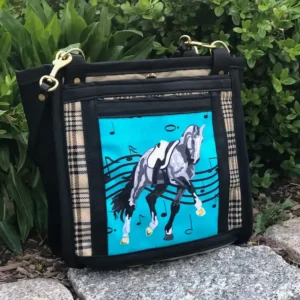 Custom black and blue tote bag featuring a detailed illustration of a horse, with a leather shoulder strap.
